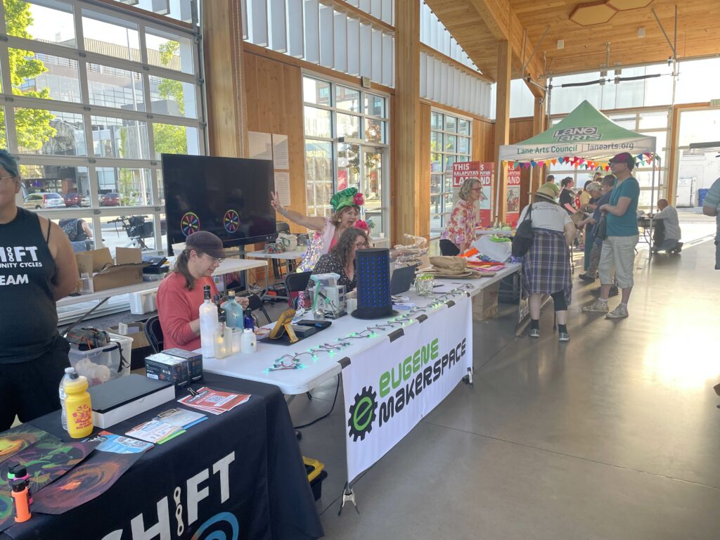 The EMS table, alongside Shift and Eugene Bright Parade.